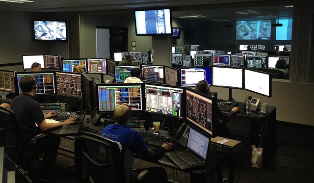 Image of a cybersecurity operations center, with analysts monitoring threats.