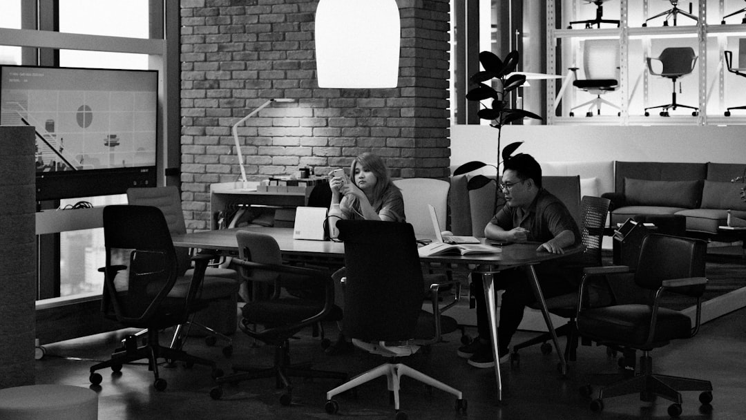 A diverse group of IT professionals smiling and collaborating in a modern office, symbolizing trust and expertise.