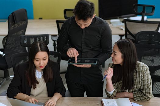 Orgif Solutions team collaborating in a modern open-plan office environment
